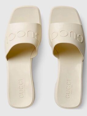 Gucci Women's Ivory Embossed Logo Slide Sandals